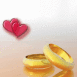 Alliances en or et coeurs translucides
