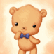 Petit ours brun avec un noeud papillon